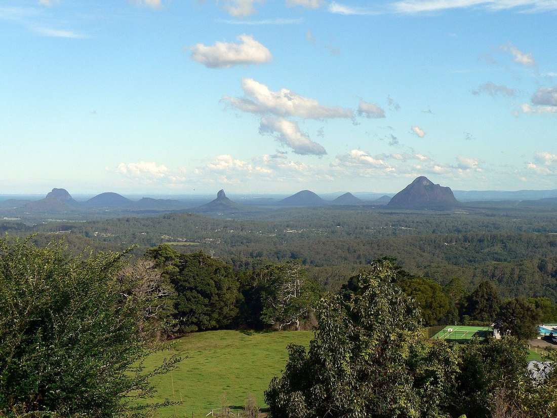 The Glass House Mountains at sunrise behind the Sunshine Coast